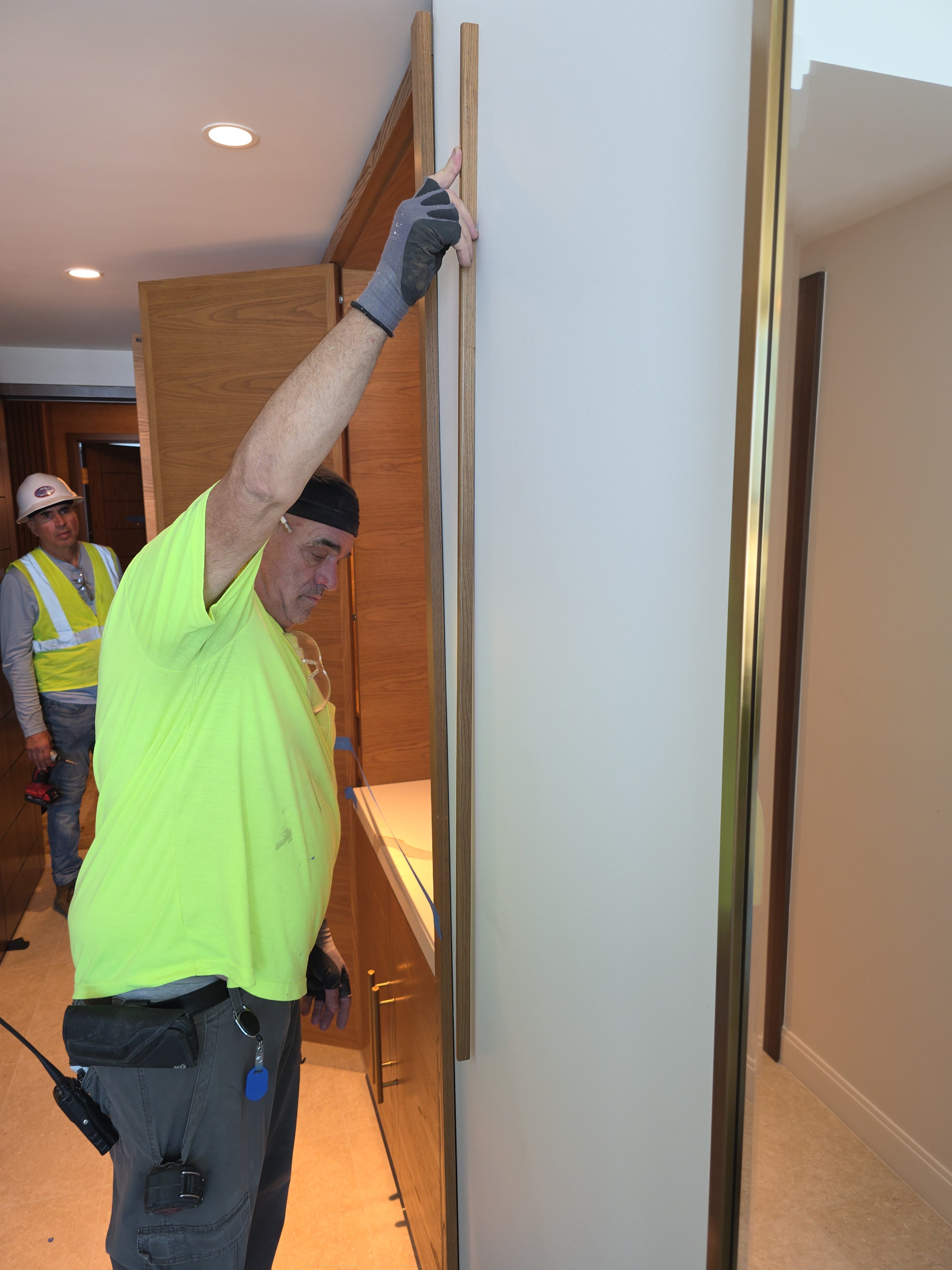 Eco Movers crew installing hotel casegood